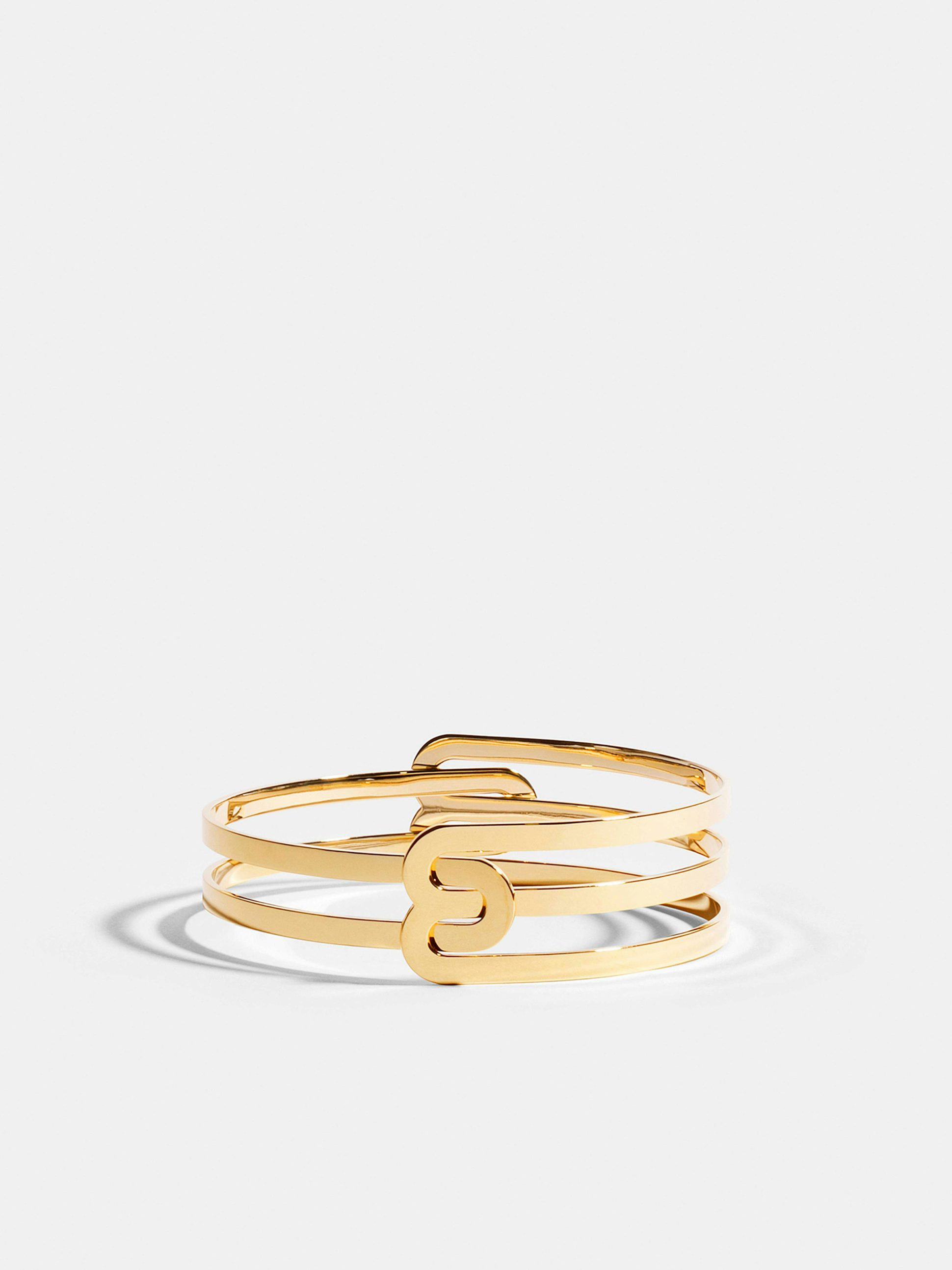 Bracelet Étreintes en Or jaune éthique 18 carats certifié Fairmined composé d'un demi-bracelet simple finition poli-brillant et d'un demi-bracelet double finition poli-brillant.