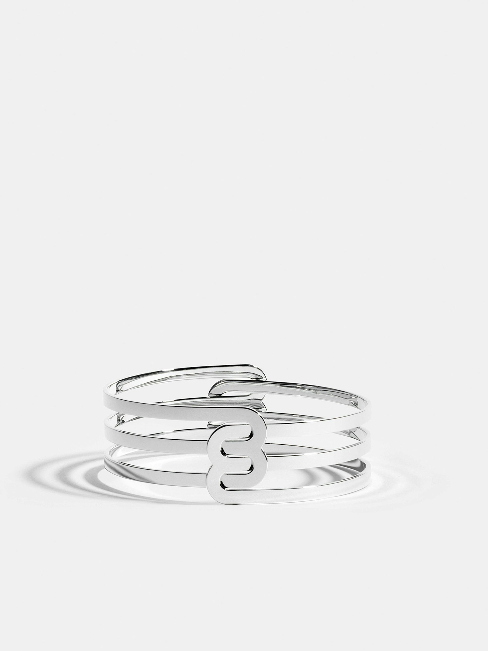 Bracelet Étreintes en Or blanc éthique 18 carats certifié Fairmined composé de deux demi-bracelets doubles finition poli-brillant.