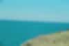 A photo of the ocean and some cliff