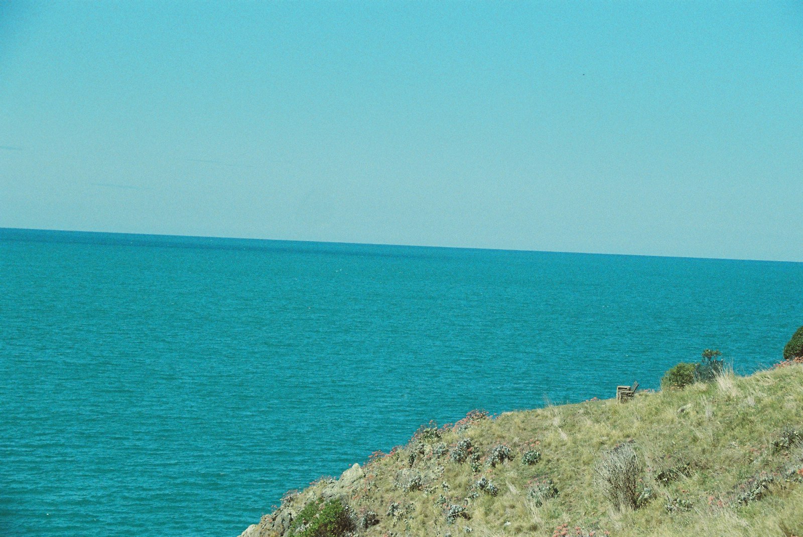 A photo of the ocean and some cliff