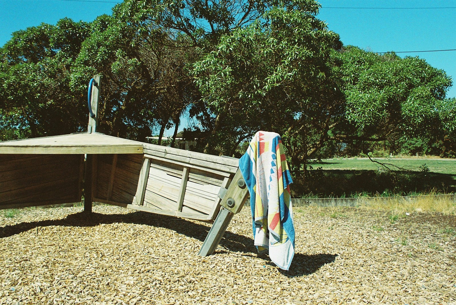 A towel hanging off some playground equipment 