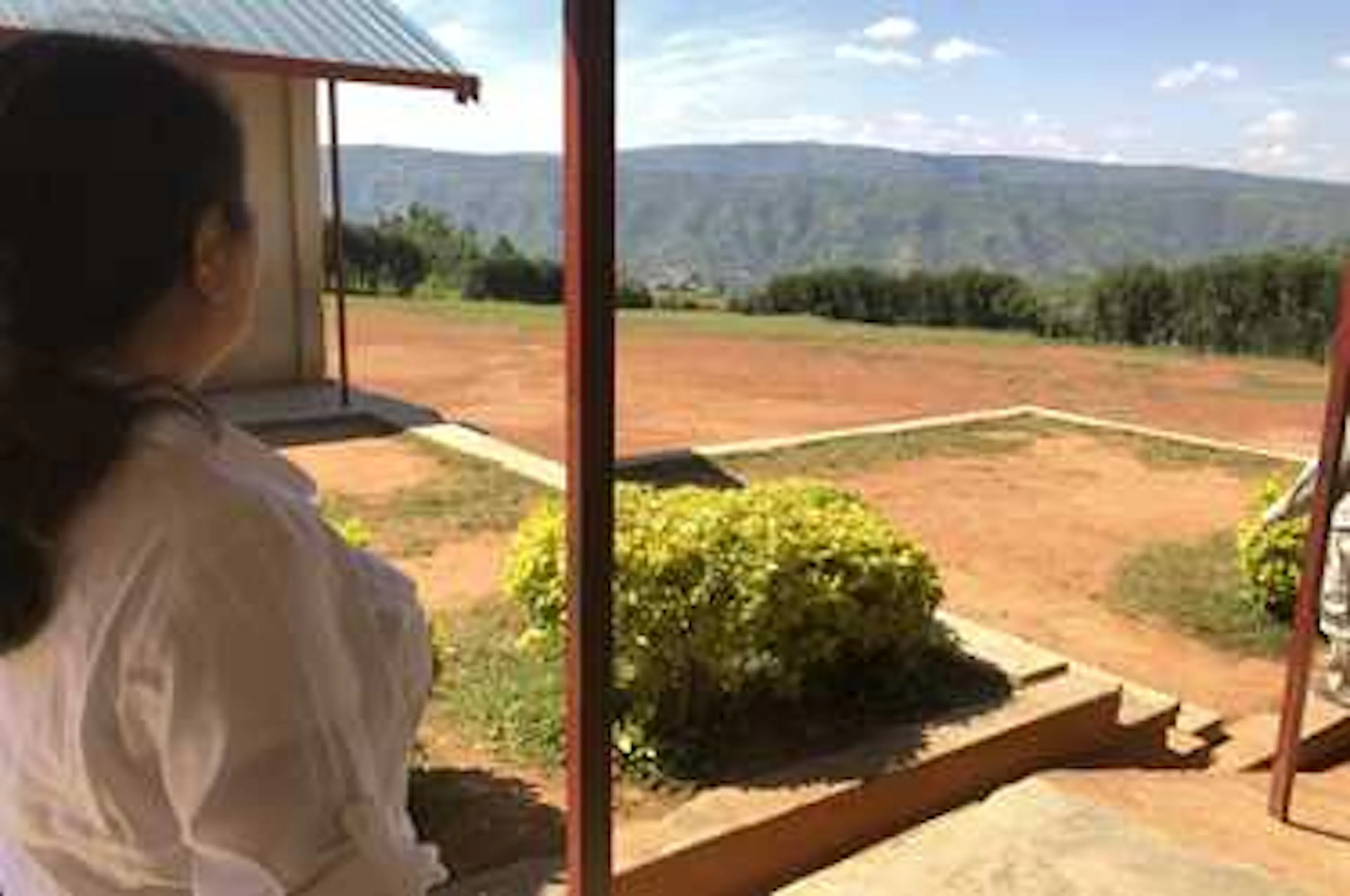 CEO Ling Chai Maginn visits the building site for a school in Kasese, Uganda
