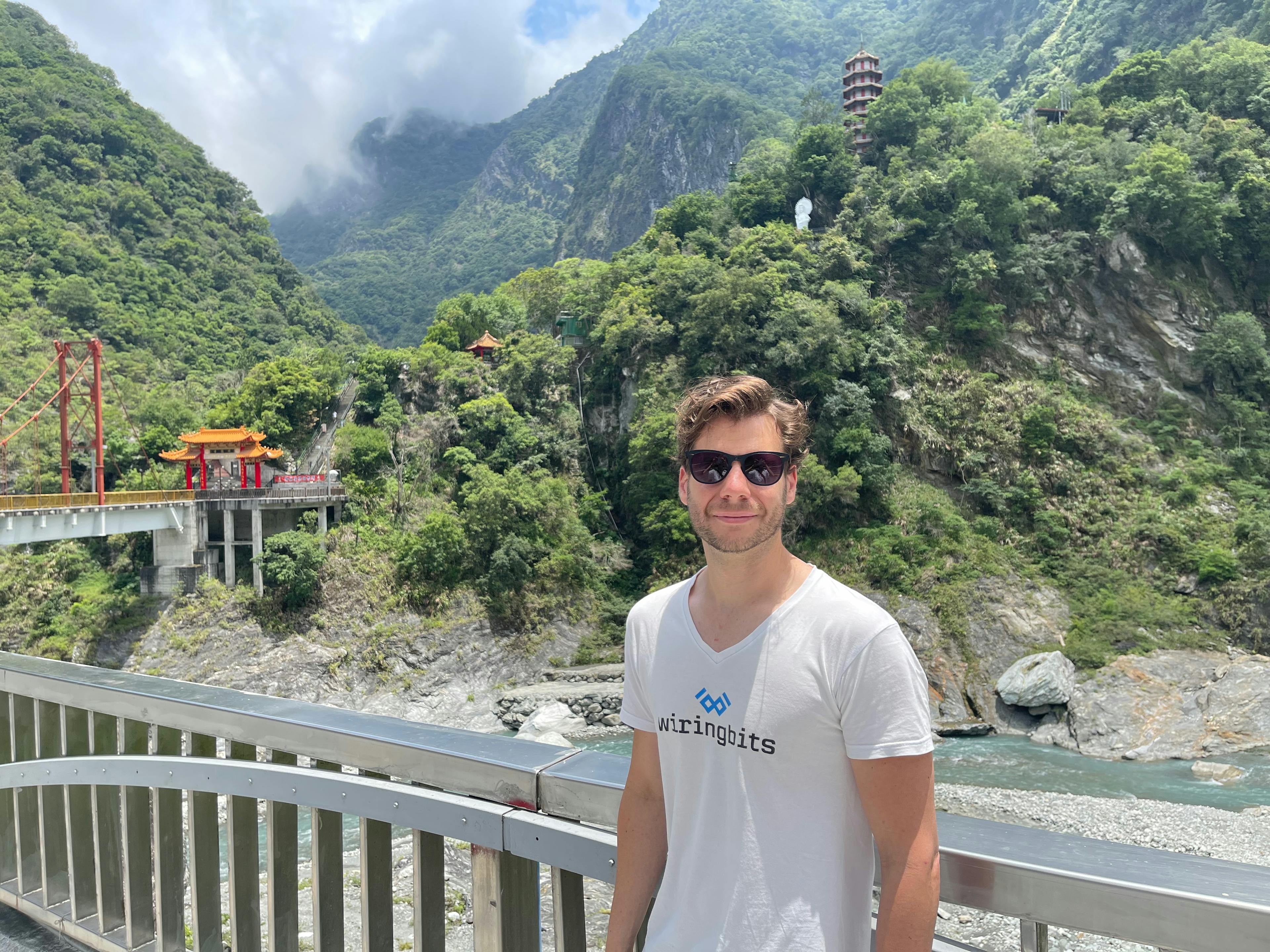 Jeremy in Taroko National Park, Taiwan with mountains in the background