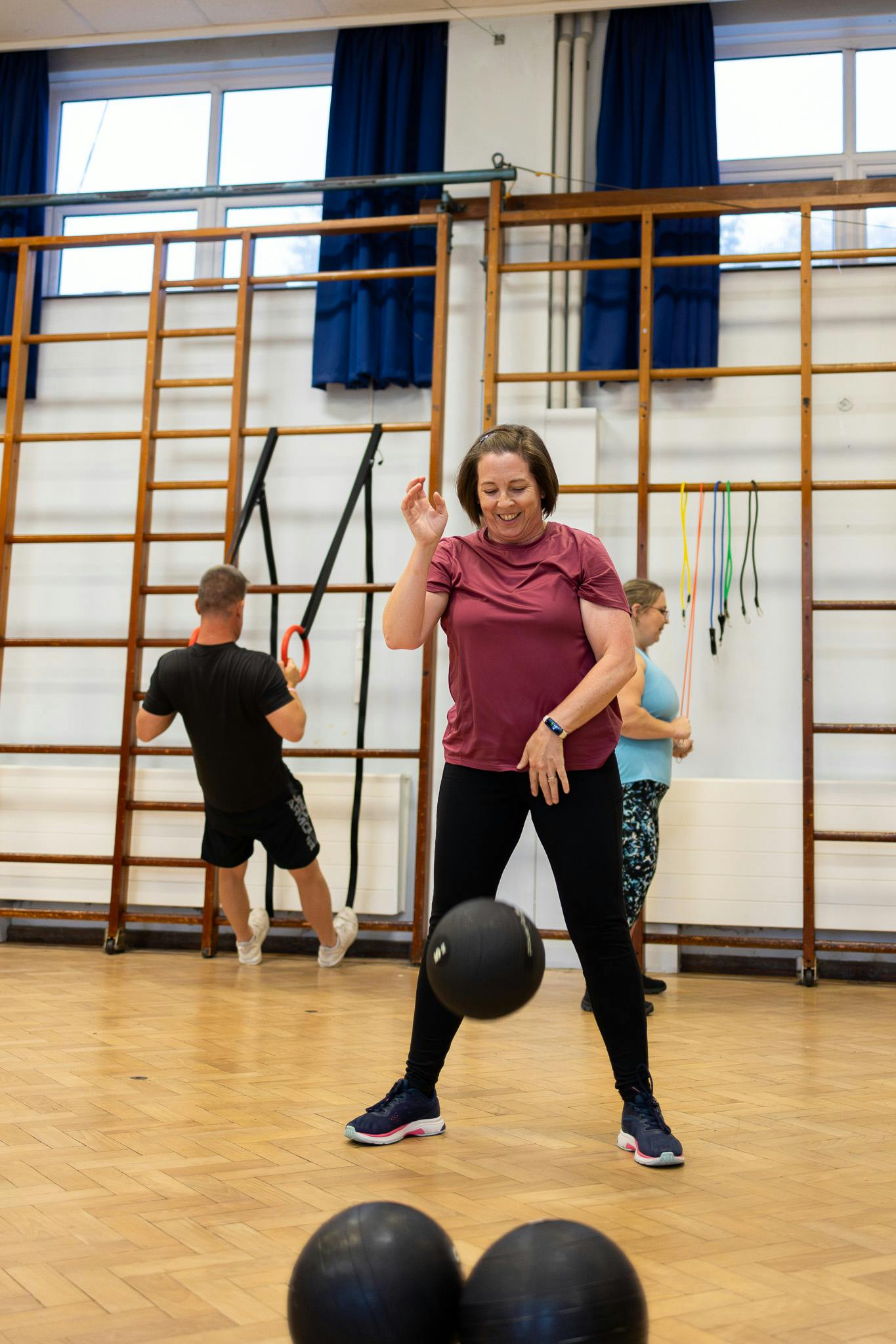 Client working with medicine ball at Jess-Fit circuit training class