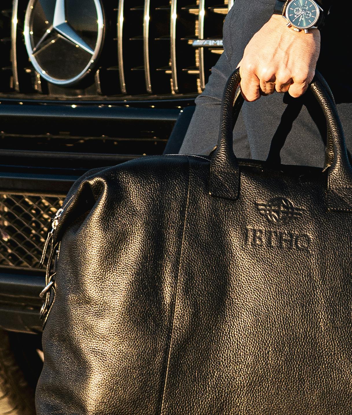 Man holding a JetHQ bag