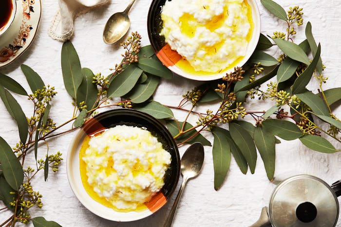 Bowls of rice pudding with saffron syrup.