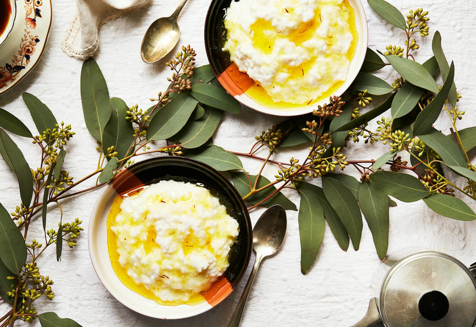 Bowls of rice pudding with saffron syrup.