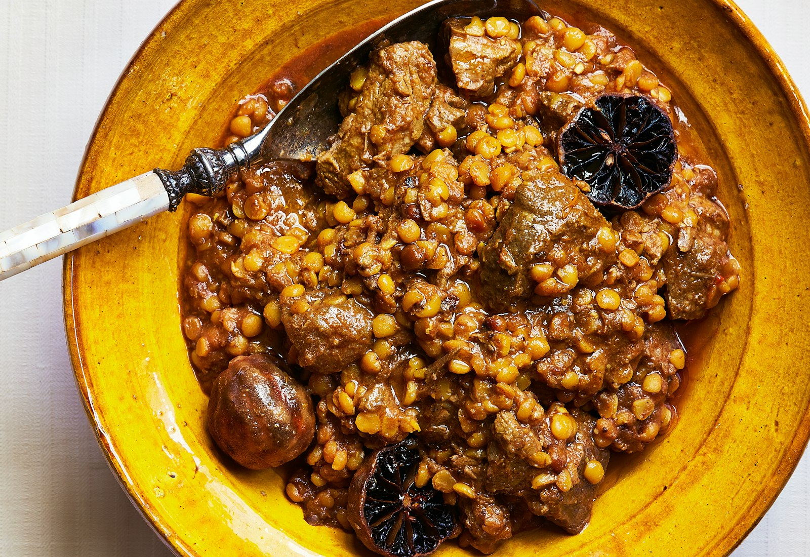 Khoresh gheymeh with dried limes. 