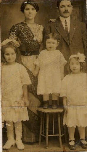 Mama Hinda (top left) and Papa Harry (back right) with their eldest three daughters Sally, Estelle and Irene in the 1910s.