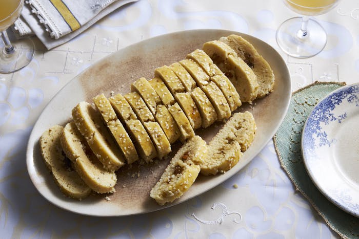 Orange blossom cookies with seeds and nuts on an oval plate.