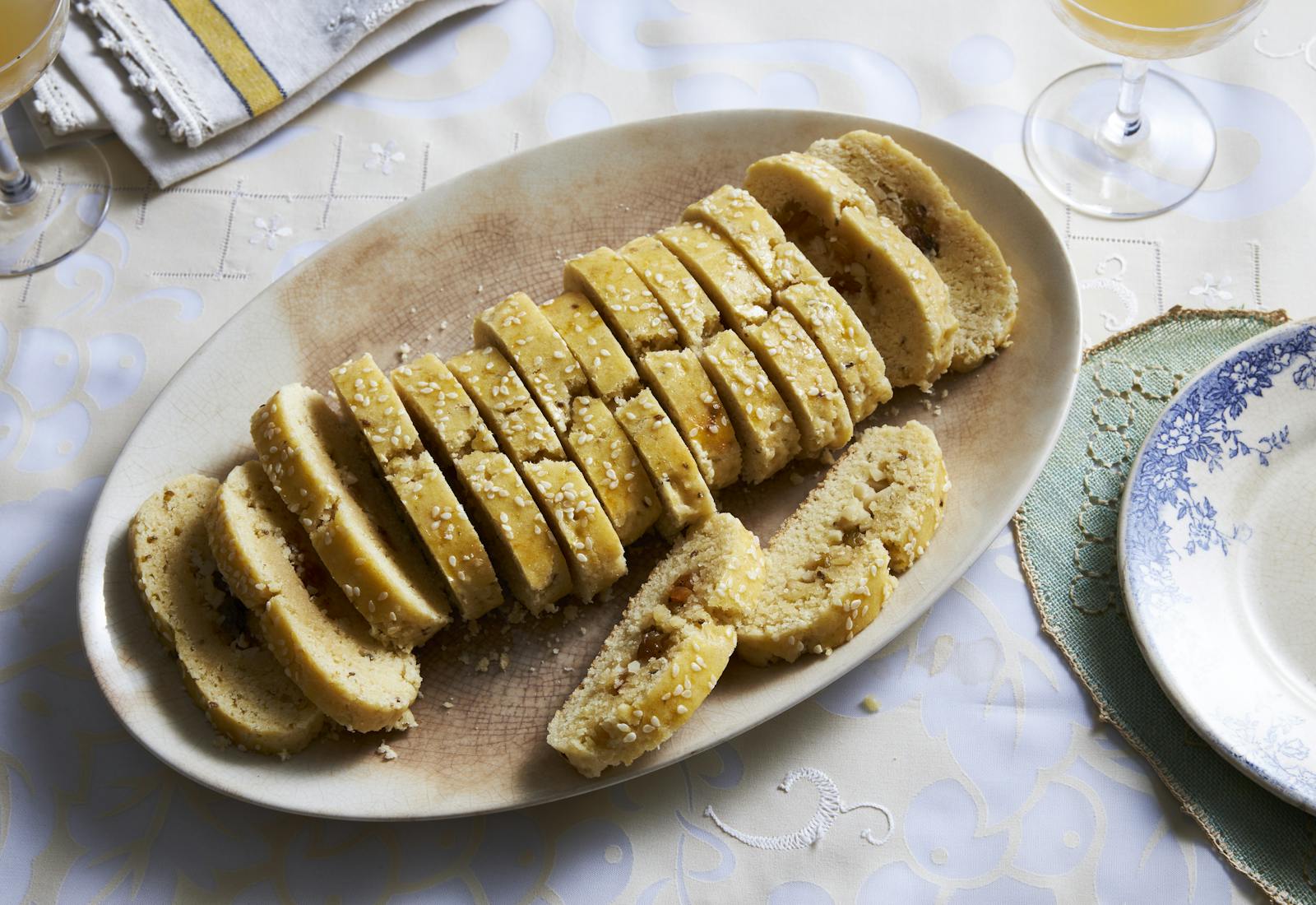 Orange blossom cookies with seeds and nuts on an oval plate.