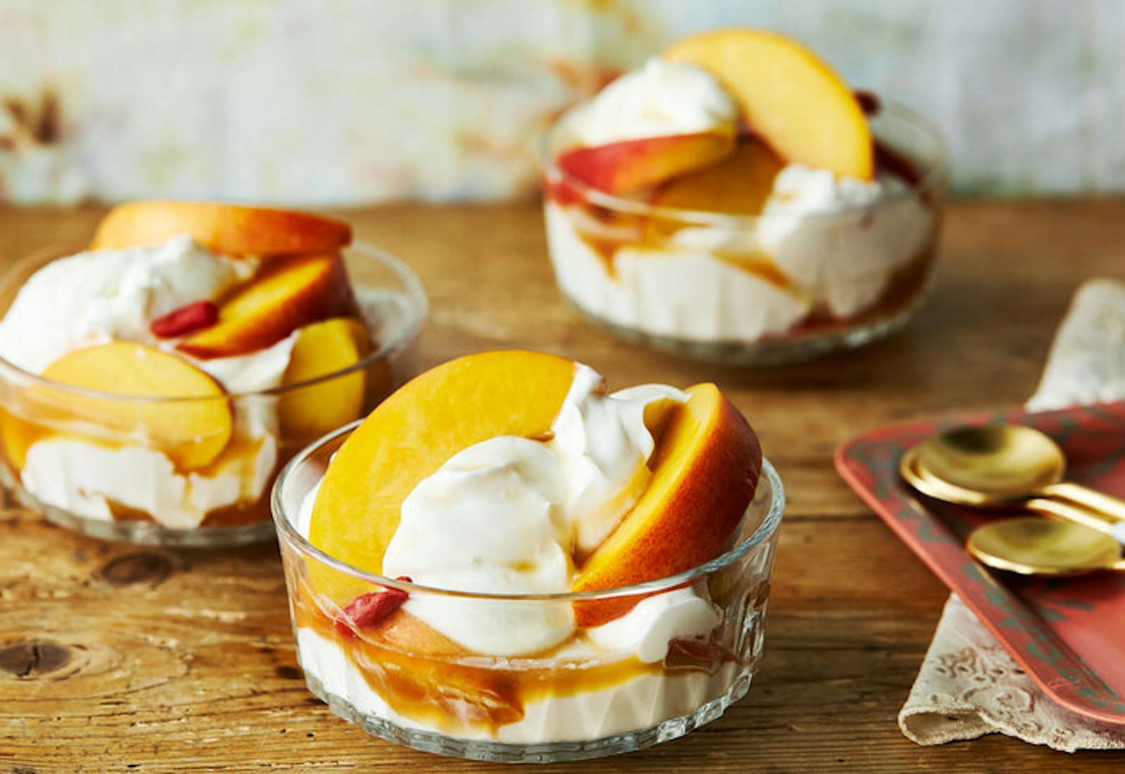 Pickled nectarines with their brine in bowls of thick vanilla yogurt 