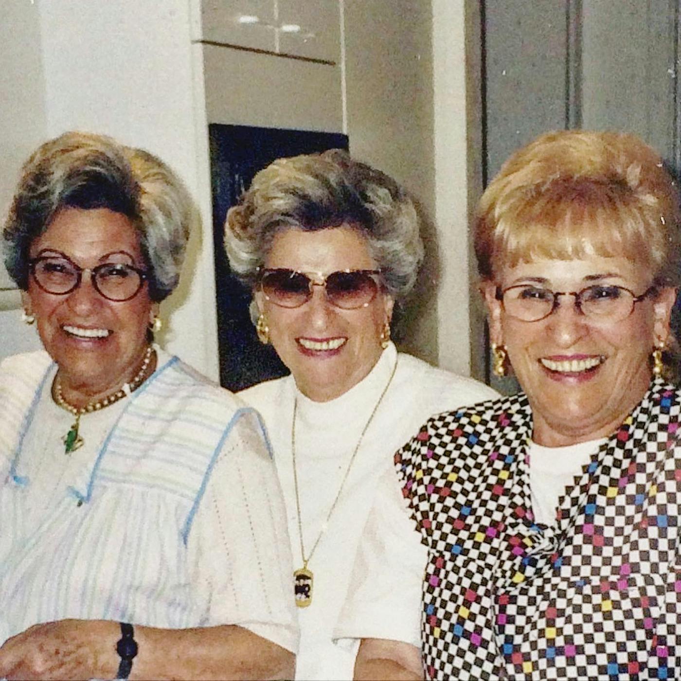 Becca's grandmother Mala (right) in the 90s, laughing with her two sisters. 