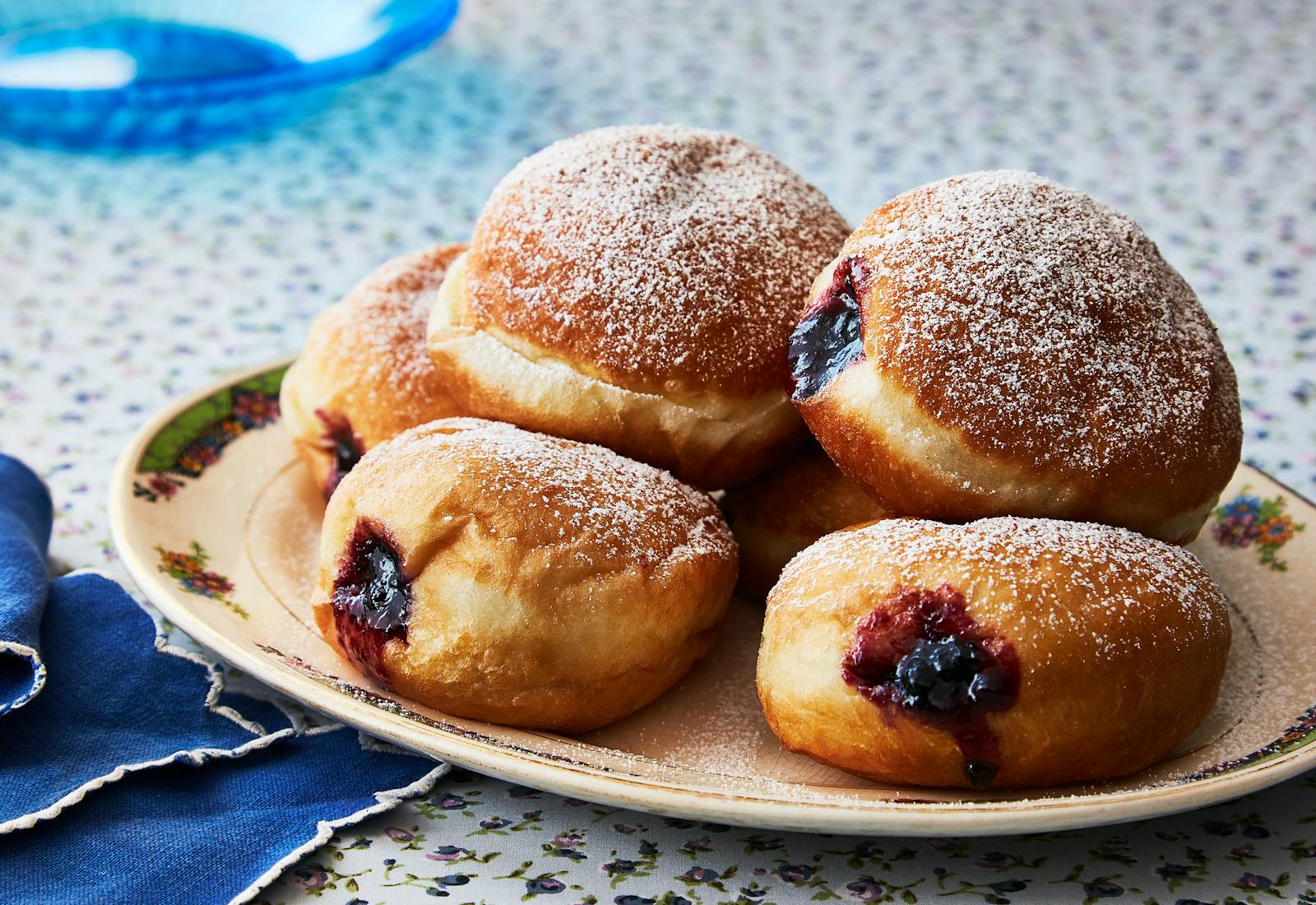 Sufganiyot filled with jam and sprinkled with powdered sugar.