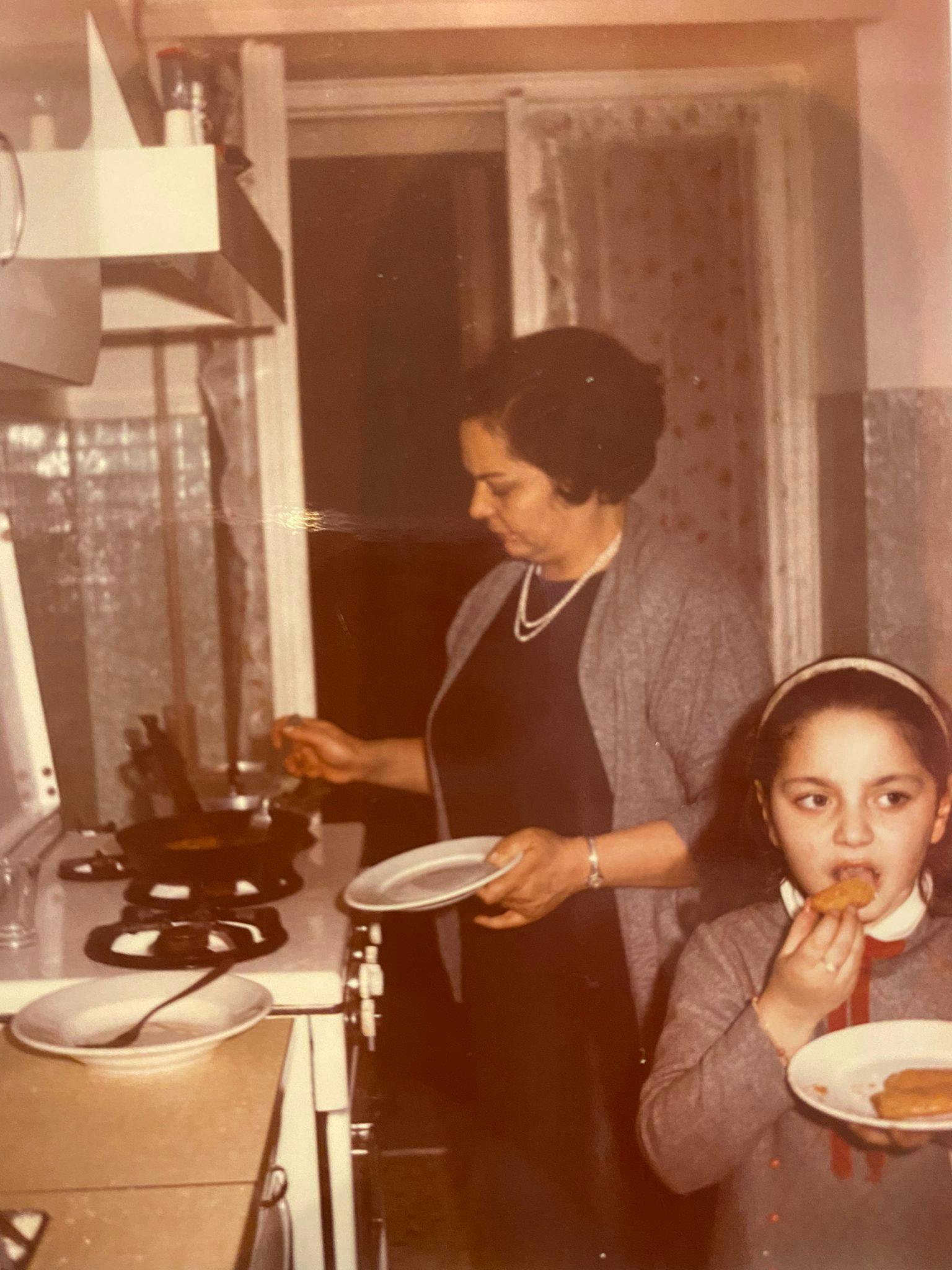 Sara's Nonna Lisa with Sara's mother, Marina cooking in the kitchen, 1967.