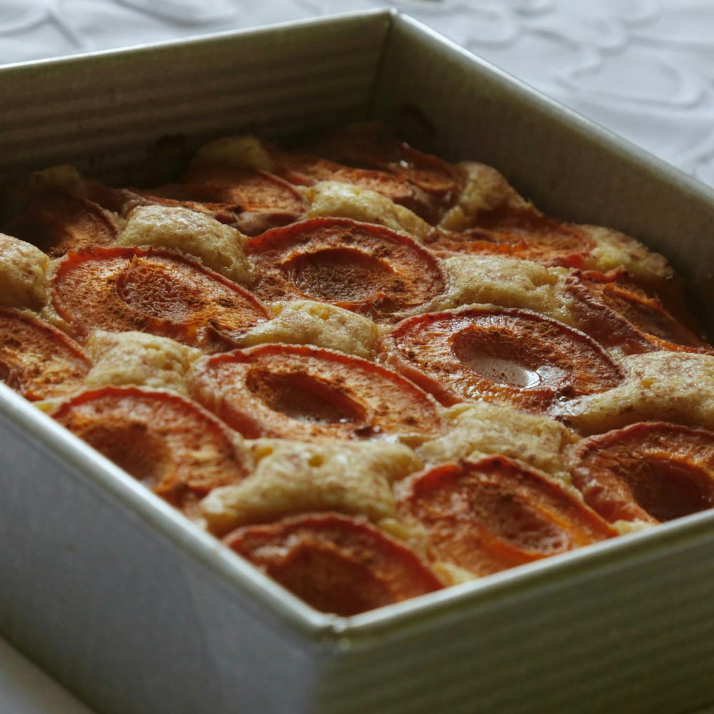 Spiced apricot cake in deep baking dish.