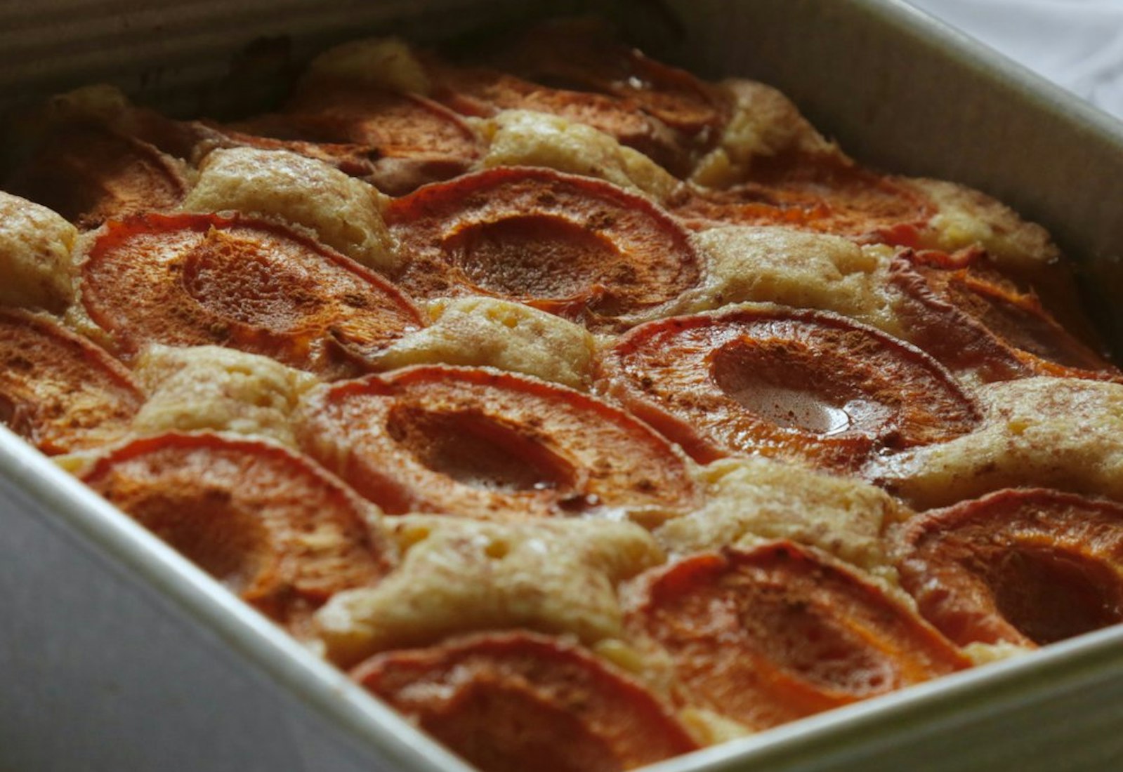 Spiced apricot cake in deep baking dish.