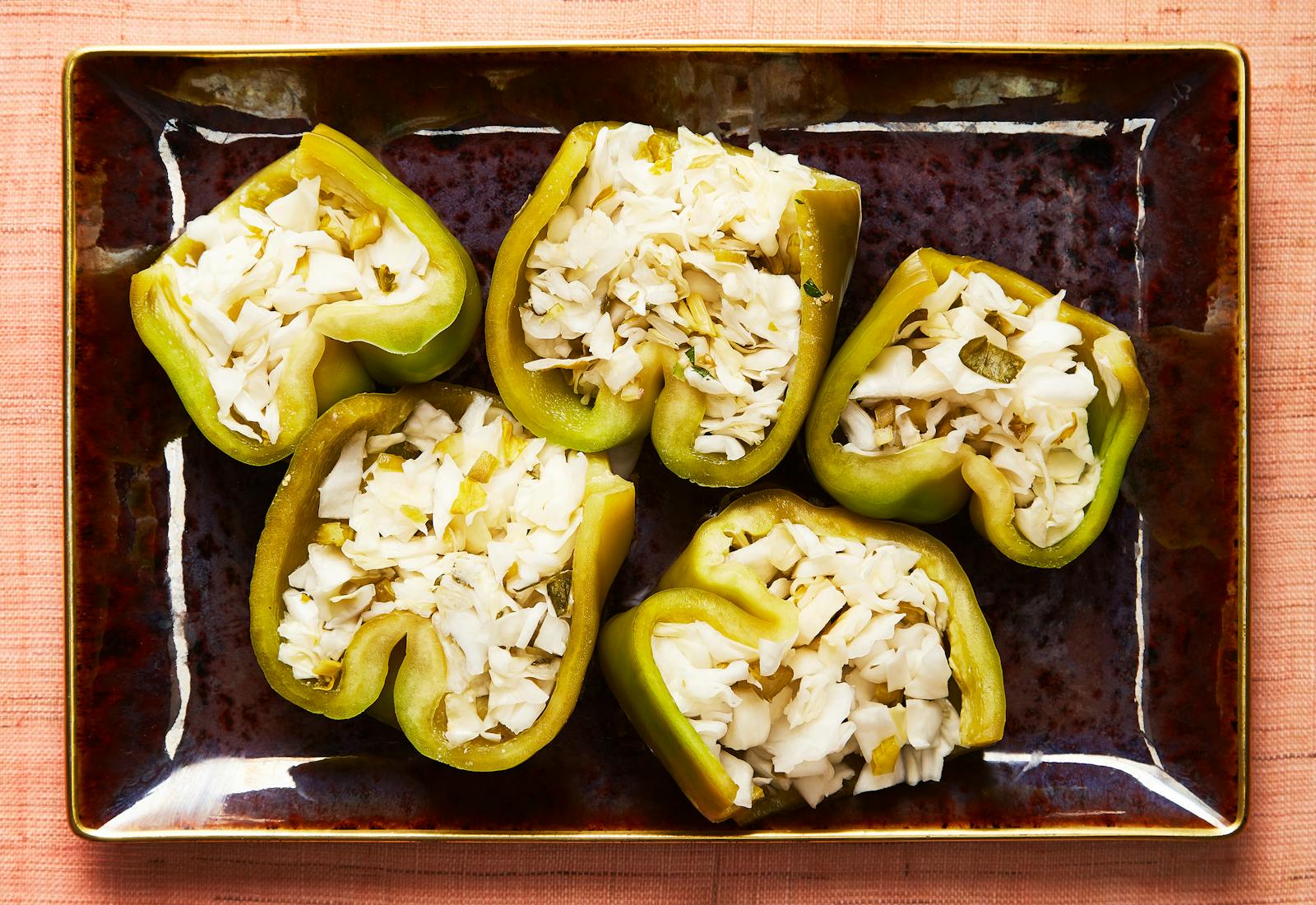 Halved pickled stuffed peppers.
