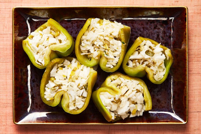 Halved pickled stuffed peppers.