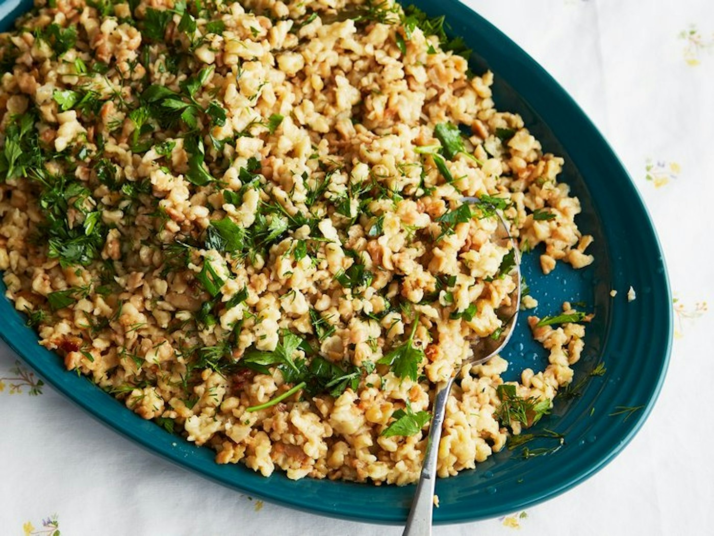 Rough pasta called egg barley on blue plate