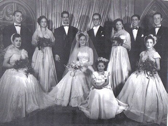 Ruth (center) on her wedding day with her family in 1950.
