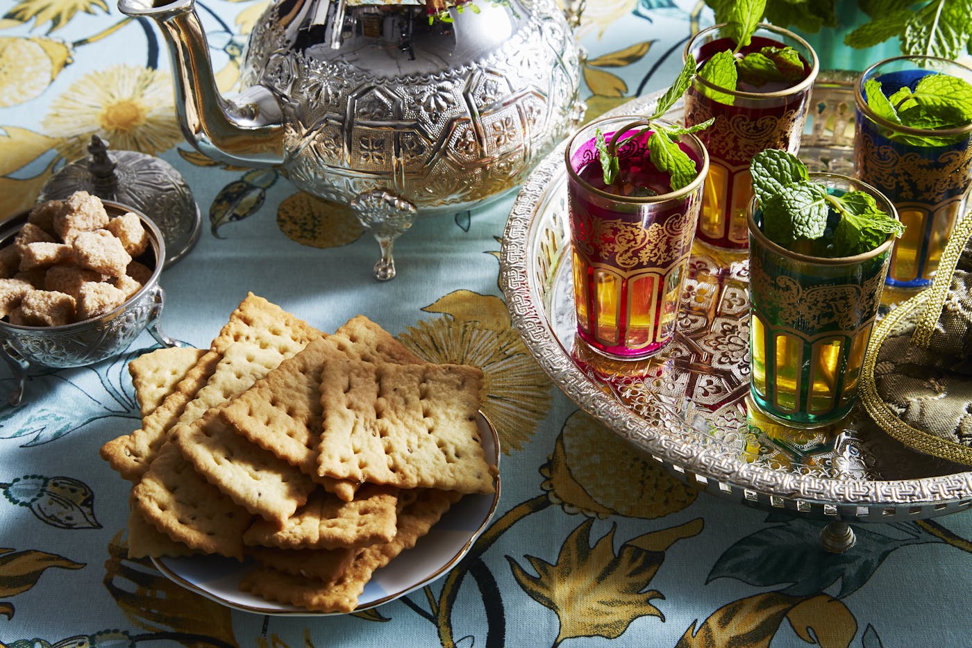 Rifat piled on plate alongside Moroccan tea.