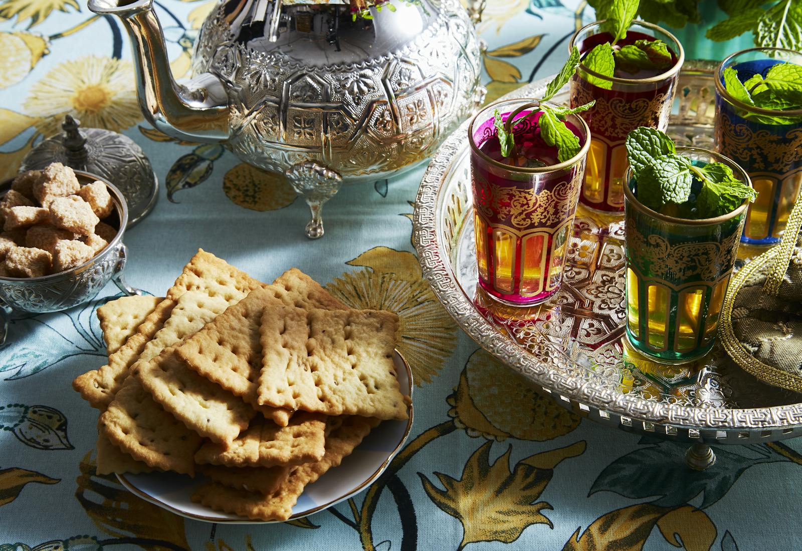 Rifat piled on plate alongside Moroccan tea.