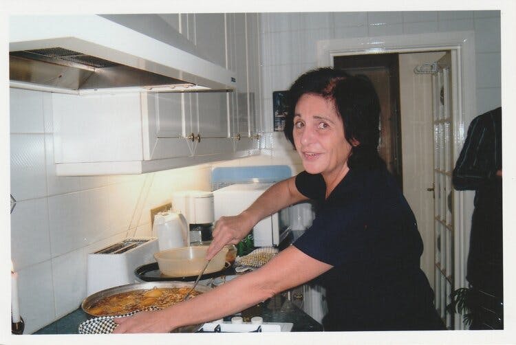 Esther, Max Nye’s mother, frying potatoes for a dish called aloo makqualla.