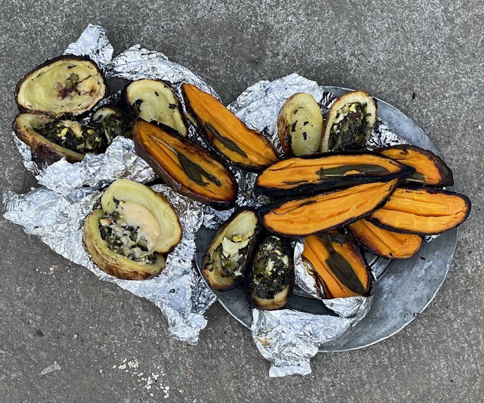 Fire-Cooked Sweet Potatoes Stuffed With Sage and Butter image
