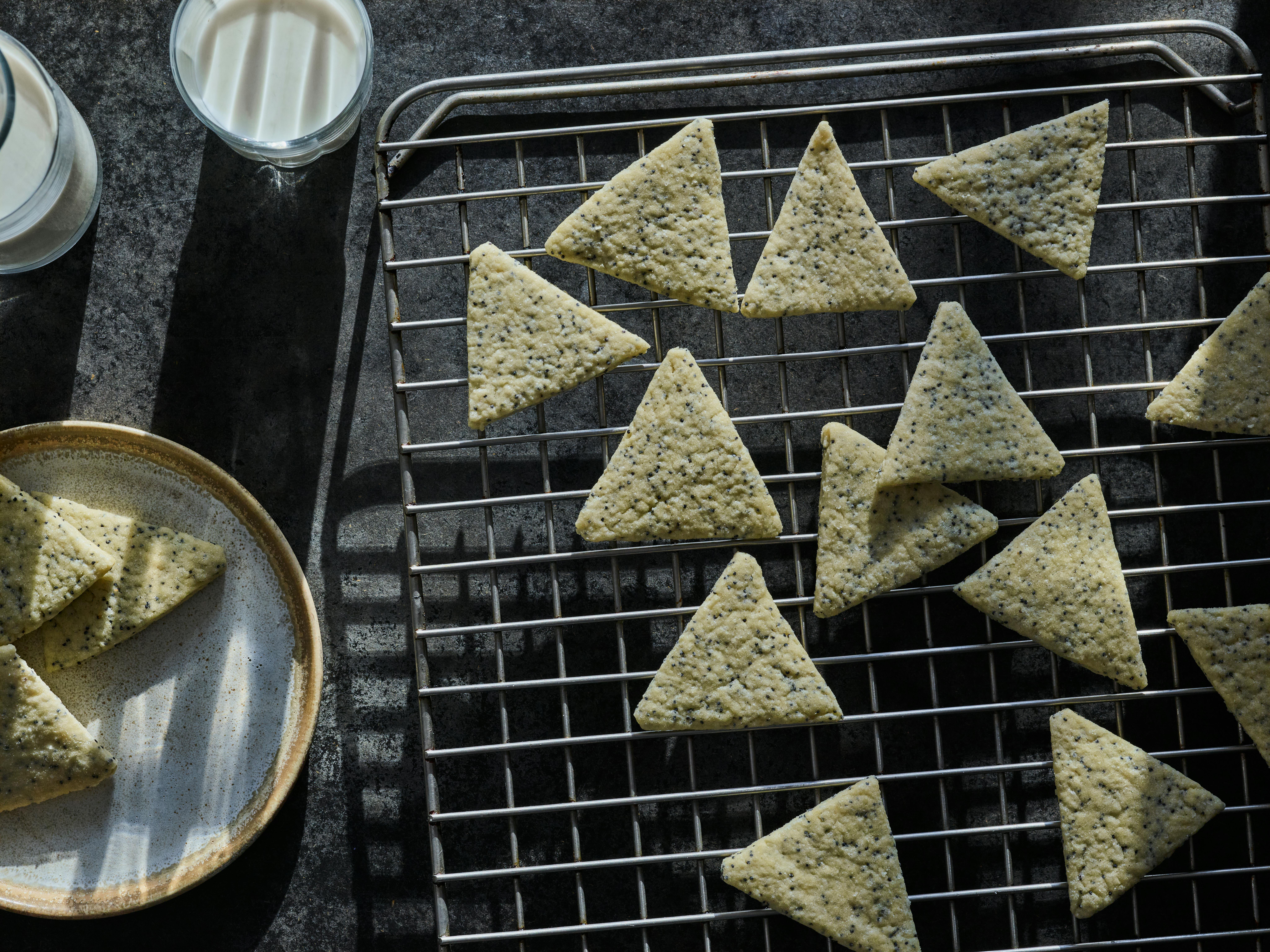 Triangle shaped cookies with poppy seeds