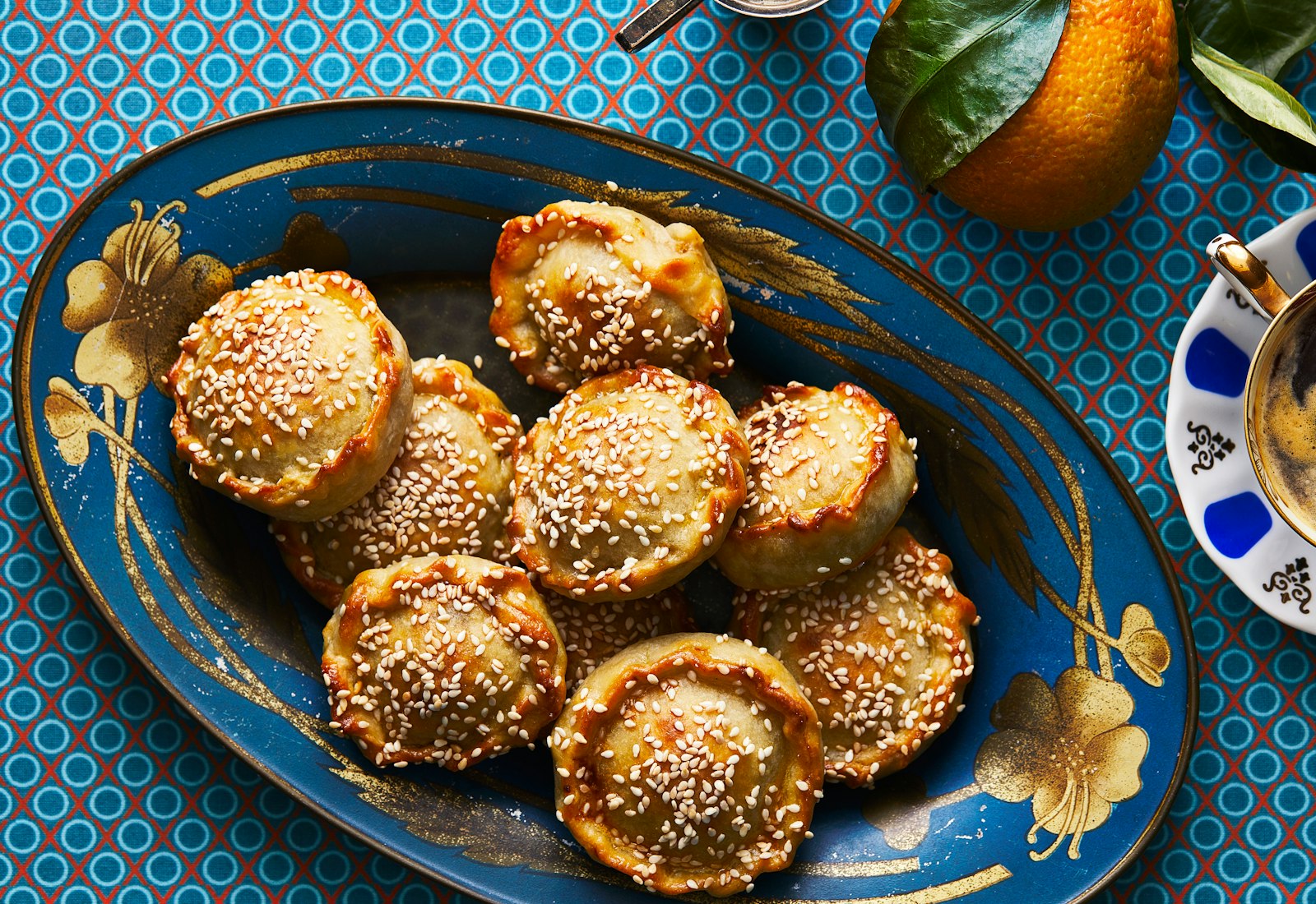 Pastelikos piled on blue and gold floral serving platter.