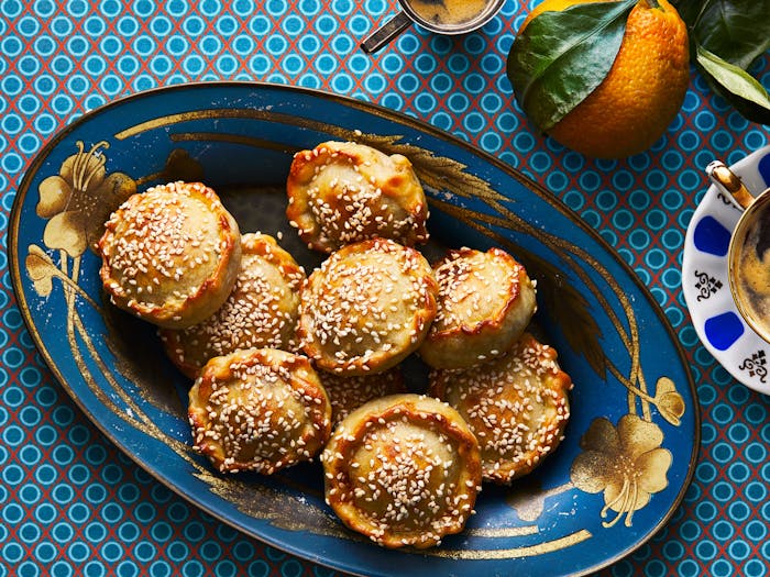 Pastelikos piled on blue and gold floral serving platter.