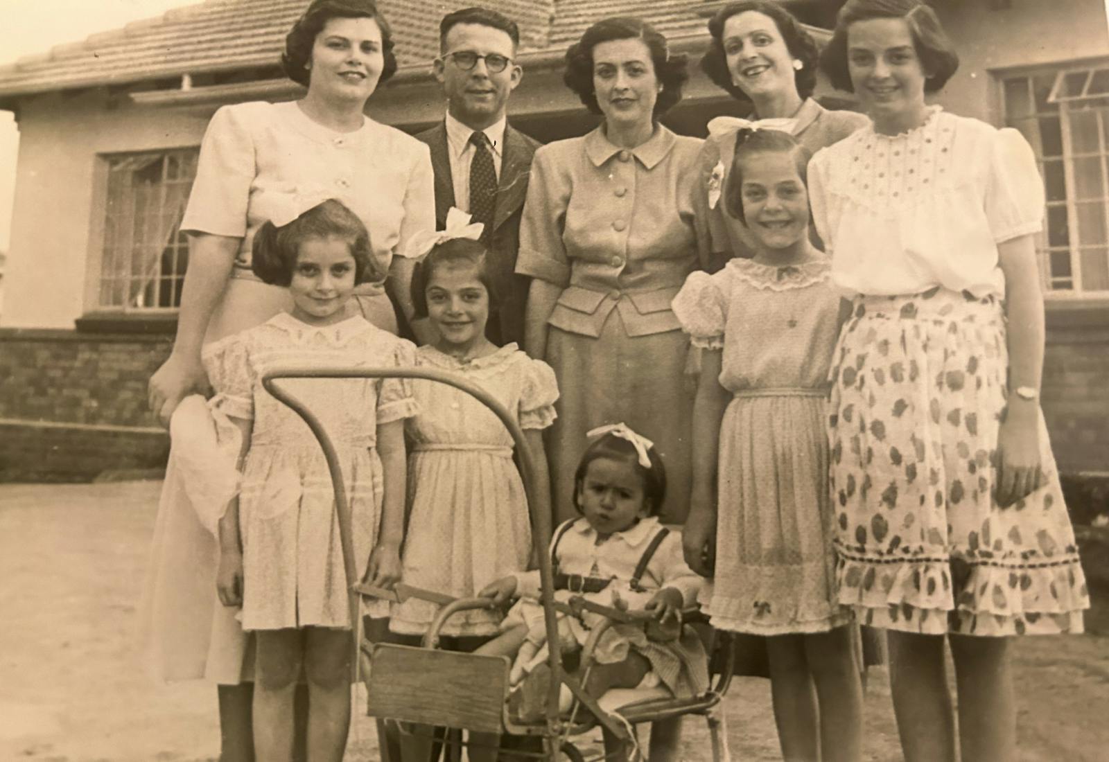 Vivienne Capelouto with her parents, her sister, three first cousins, and two aunts