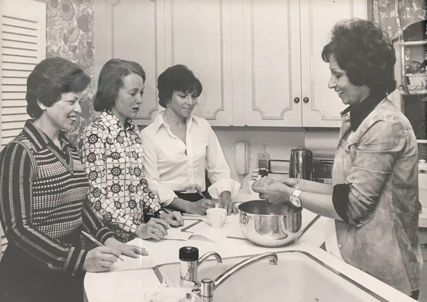 Etty, on the right, teaching a Persian cooking class to some area housewives in Providence, Rhode Island.