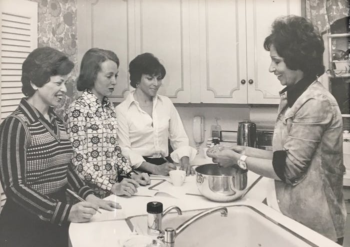 Etty, on the right, teaching a Persian cooking class to some area housewives in Providence, Rhode Island.