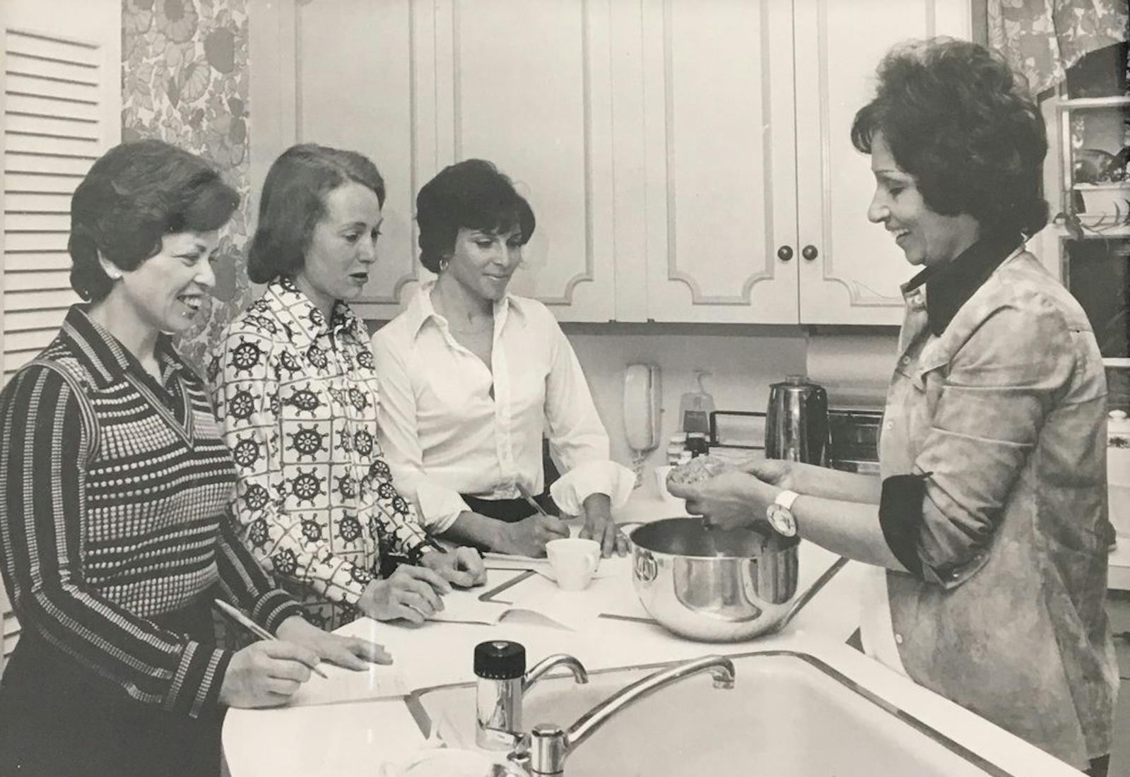 Etty, on the right, teaching a Persian cooking class to some area housewives in Providence, Rhode Island.