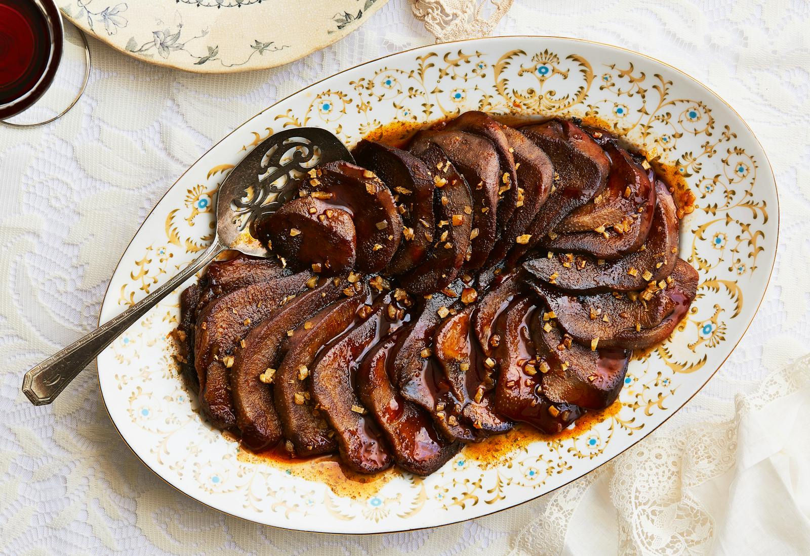 Seared beef tongue on serving platter.