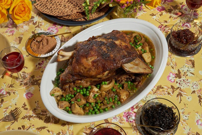 Braised lamb with sides of spices, chopped olives, confit red onions and pomegranate jam.