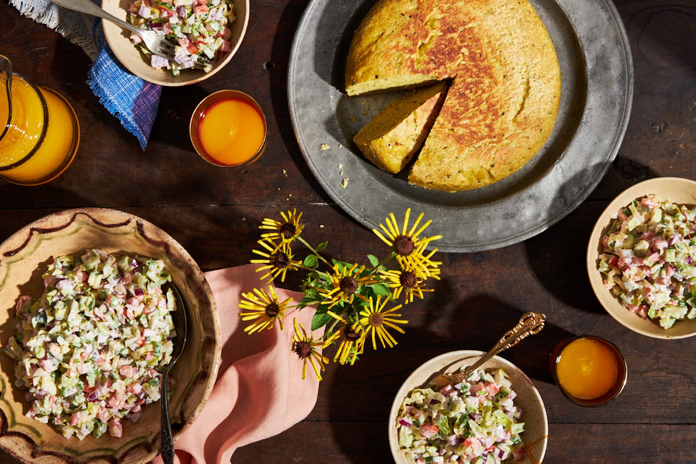 Ethiopian Shabbat breakfast table with salad and dabo bread