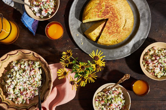 Ethiopian Shabbat breakfast table with salad and dabo bread