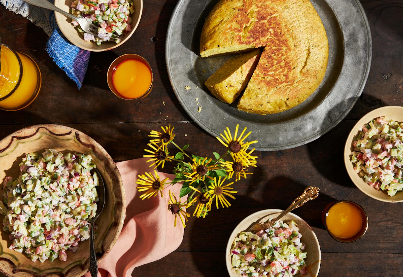 Ethiopian Shabbat breakfast table with salad and dabo bread