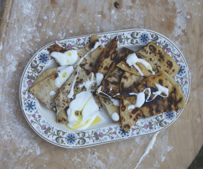 Fire-Cooked Pita Stuffed With Zaatar and Garlic image
