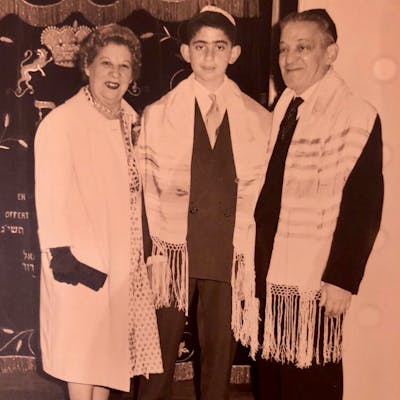 Claude at his bar mitzvah celebration with his grandparents in Paris in 1959.
