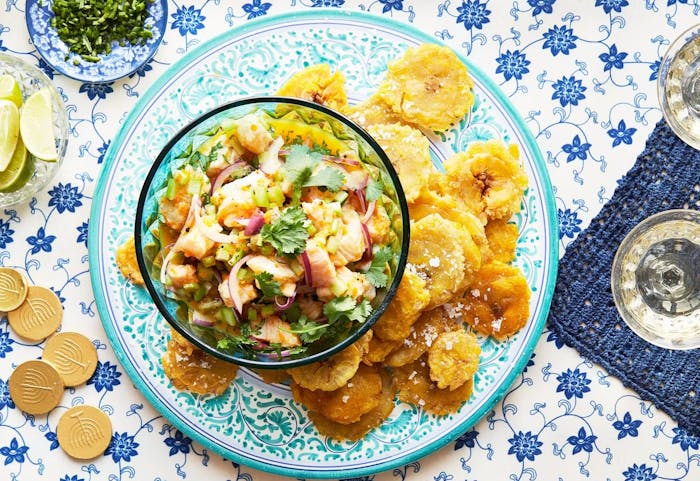 Tostones and ceviche on a blue plate