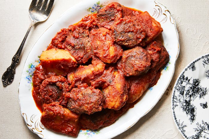 Katlet with tomato sauce and potatoes one serving platter.
