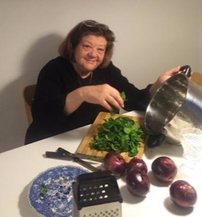 Aline preparing food in her home kitchen in Buenos Aires in the 2016.
