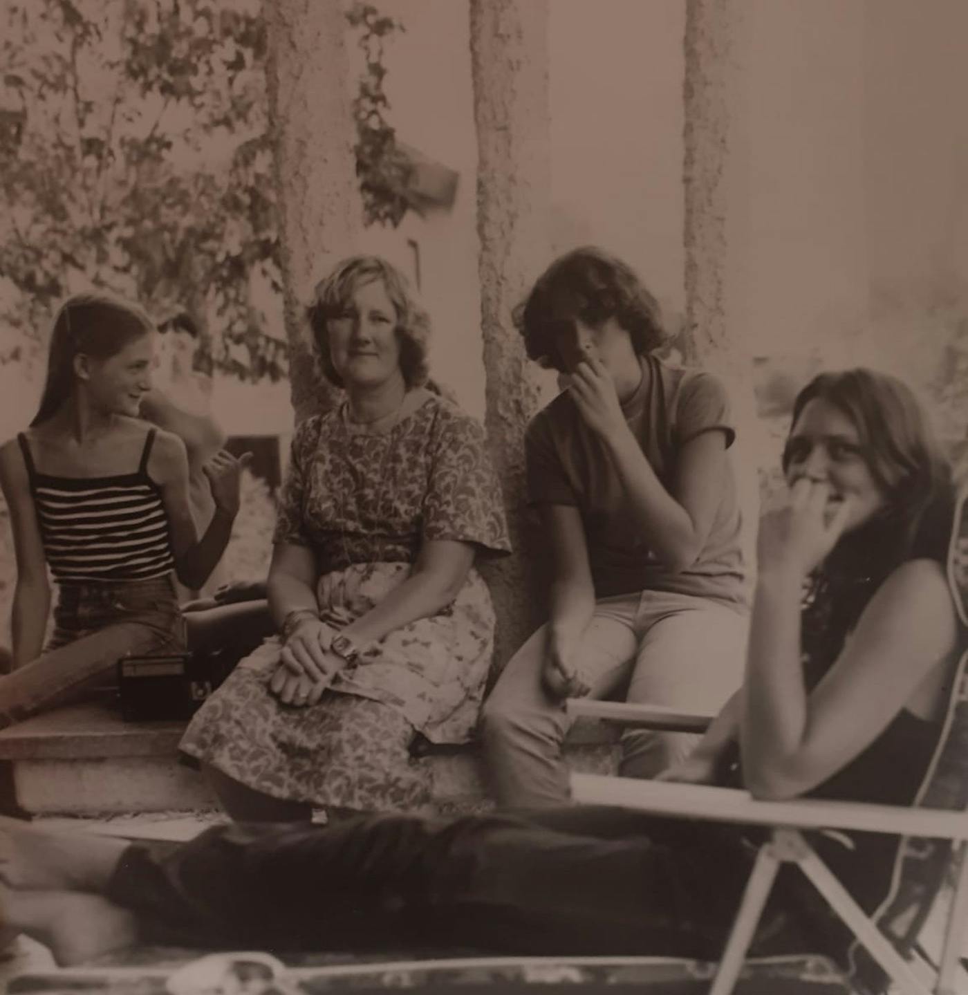 Abi's grandmother (center left) surrounded by her daughters.