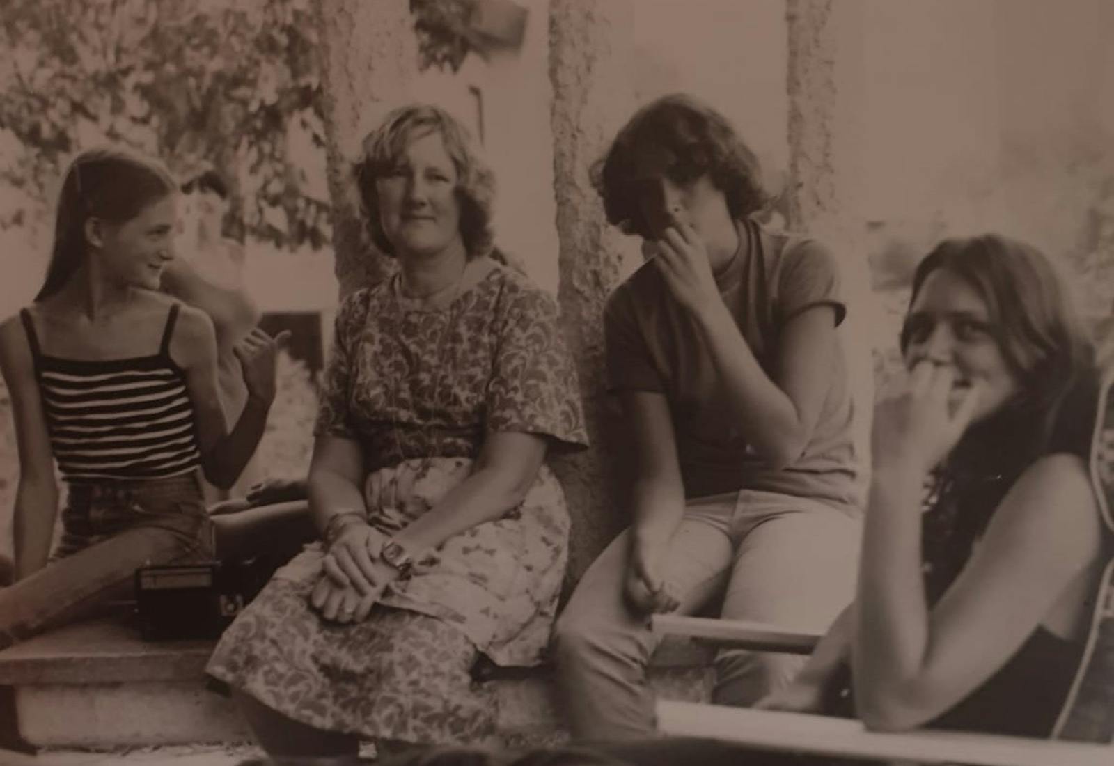 Abi's grandmother (center left) surrounded by her daughters.