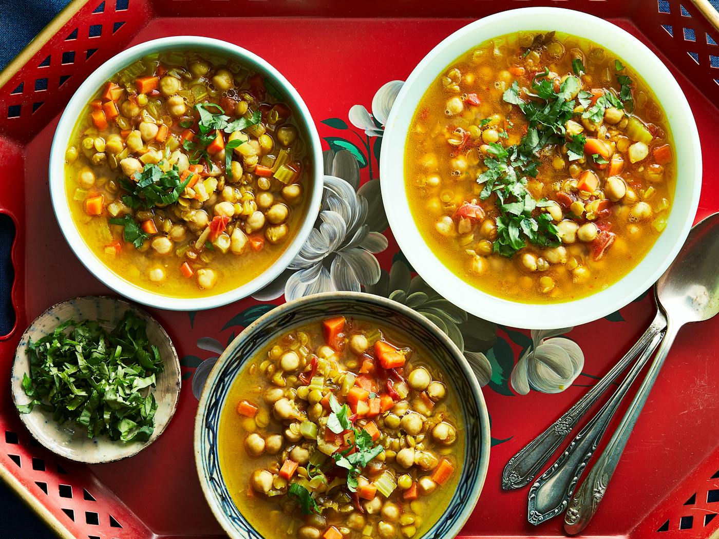 Moroccan harira soup garnished with fresh cilantro leaves.