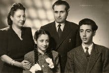 Yvet (bottom-left) pictured with her brother and parents in Thessaloniki in 1950.